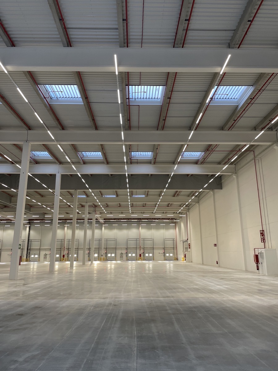 Empty warehouse view with ceiling showing