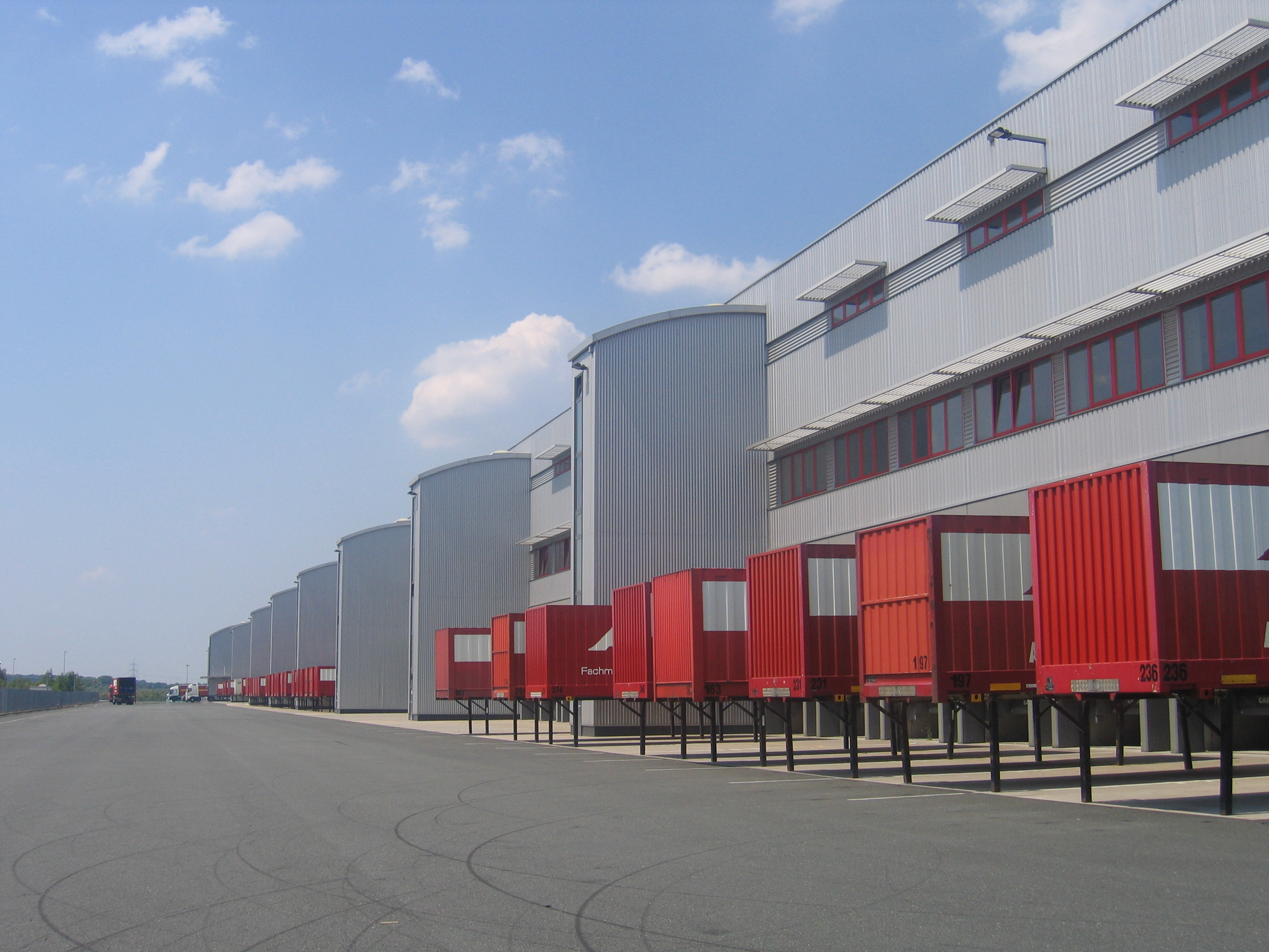 Exterior of warehouse viewing the red loading bays
