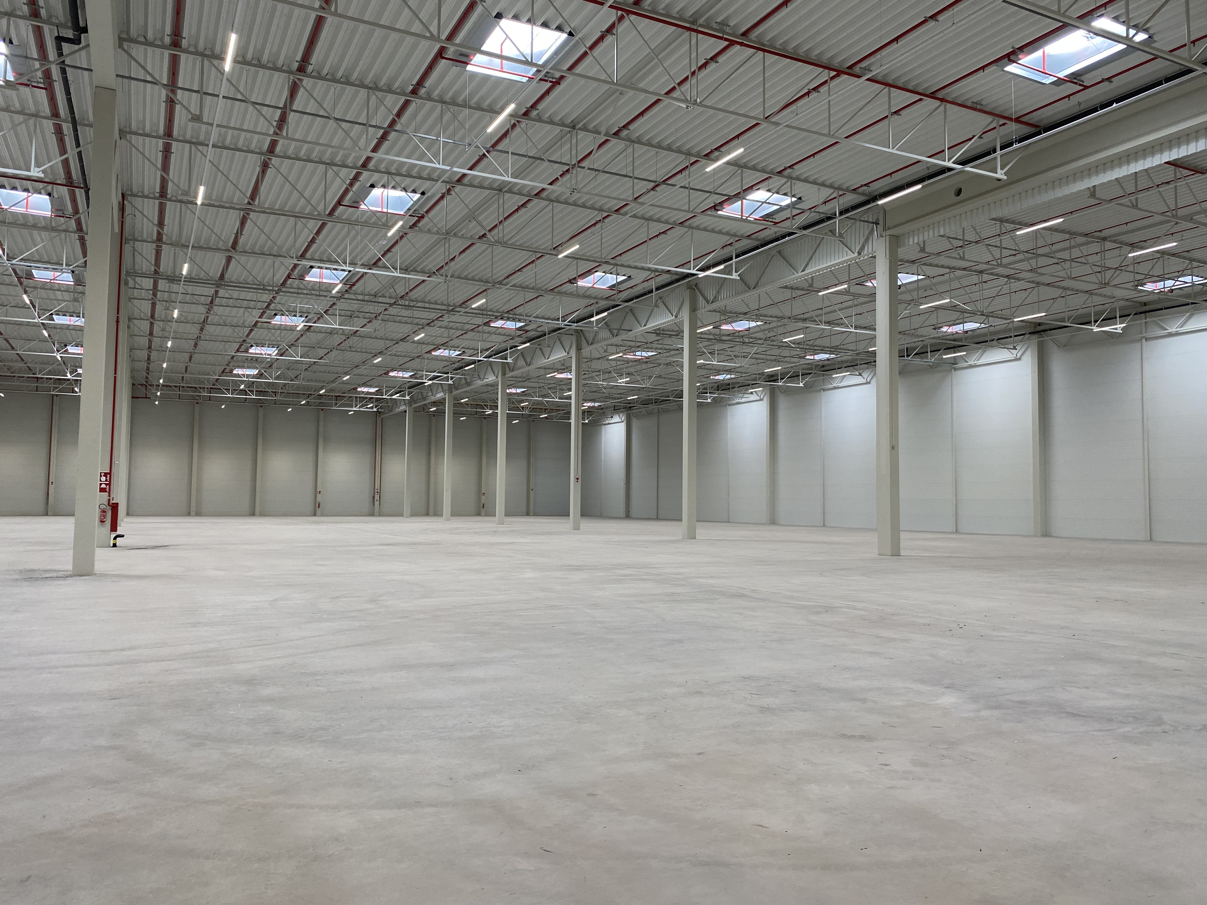 Interior of empty warehouse with poles