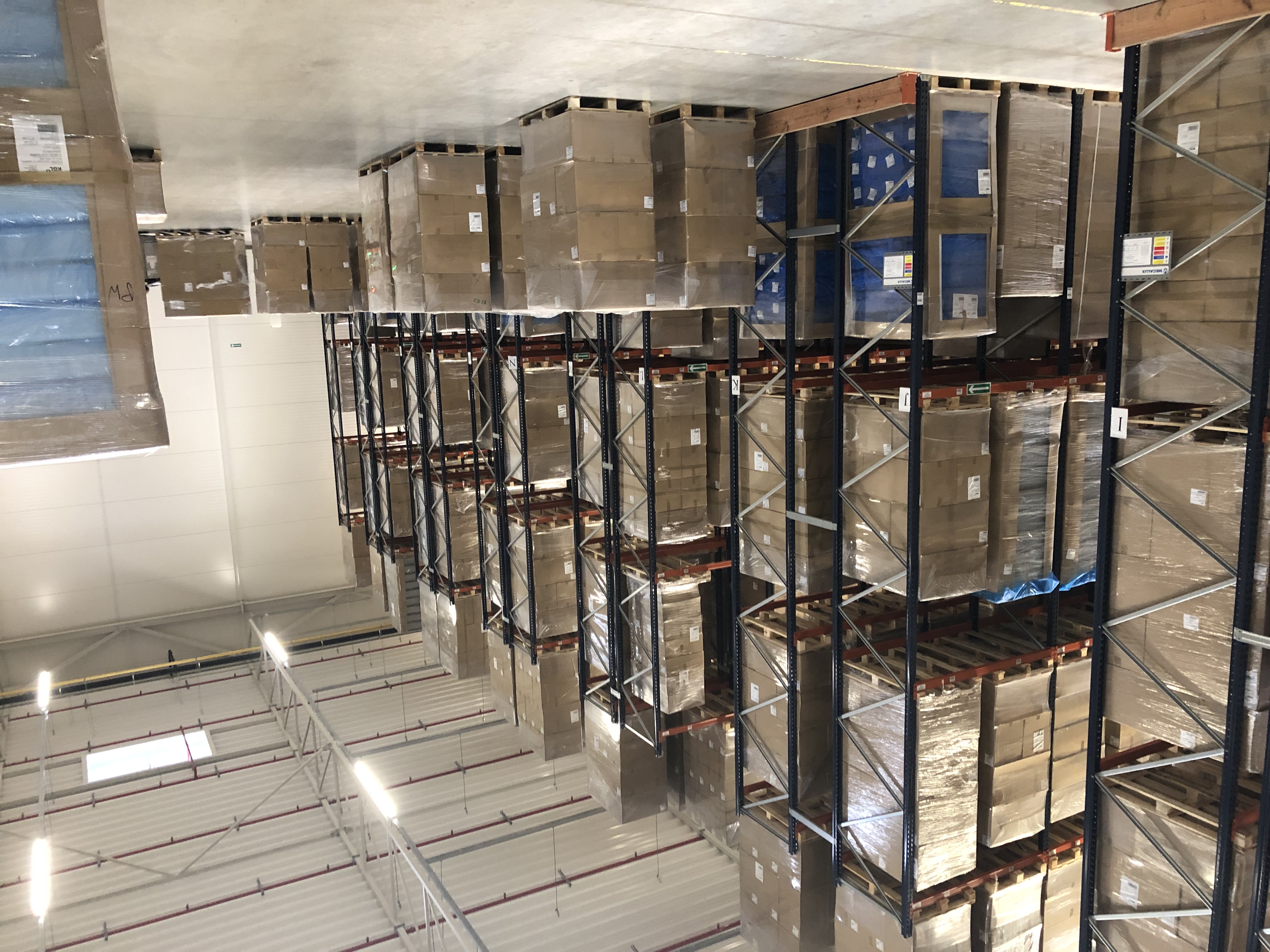 shelving inside a warehouse with boxes stacked