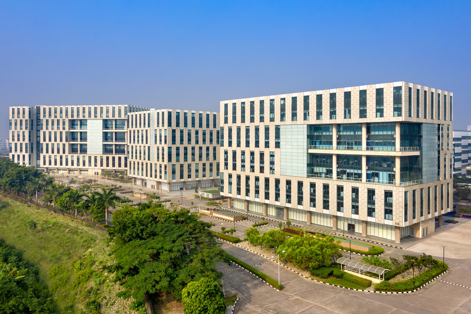 Candor Techspace, New Town Rajarhat exterior view of 3 white building with several windows