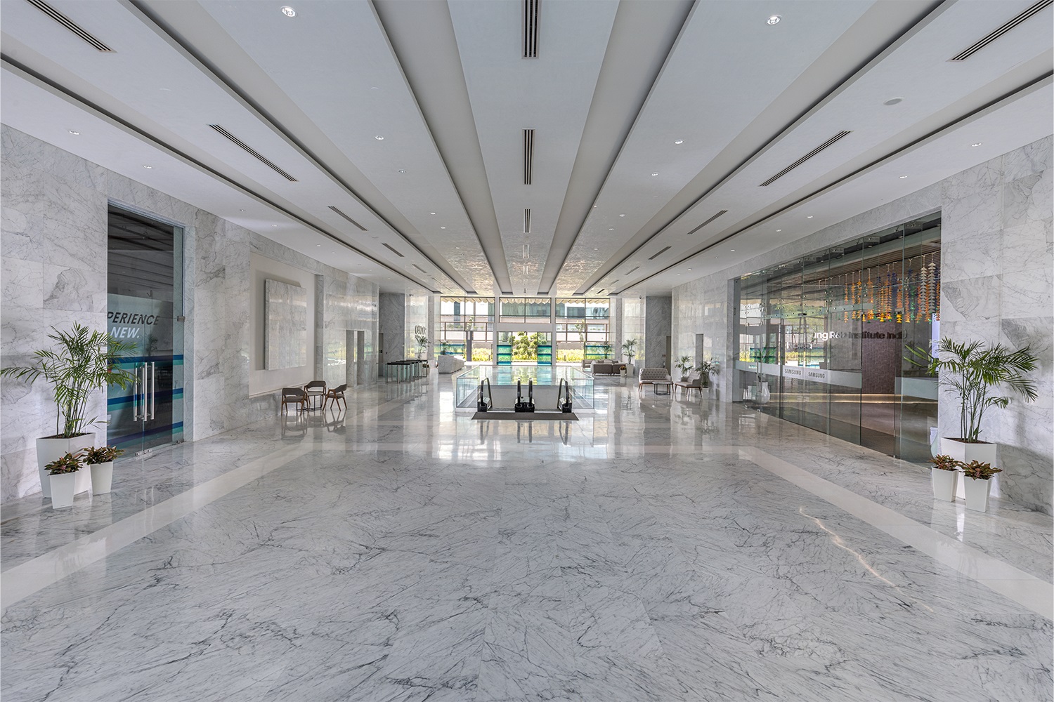 Candor TechSpace interior foyer made of white marble with black detail and near escalators