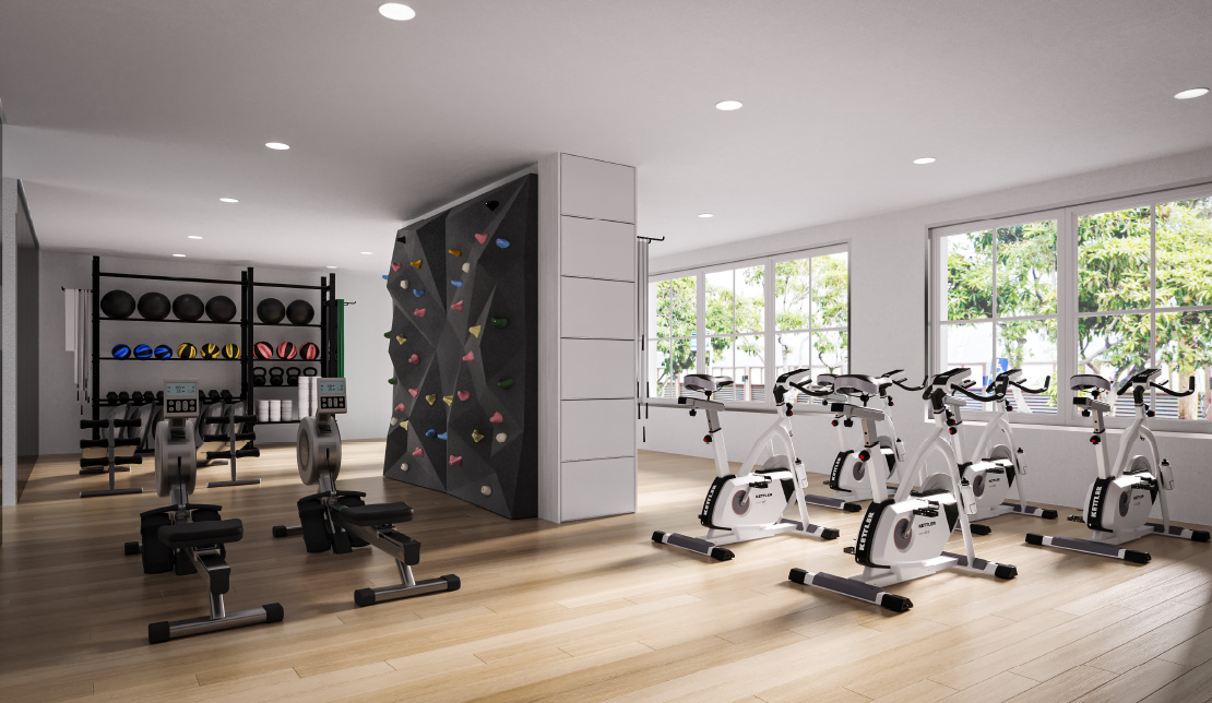 Gym with hardwood floor and exercise machines