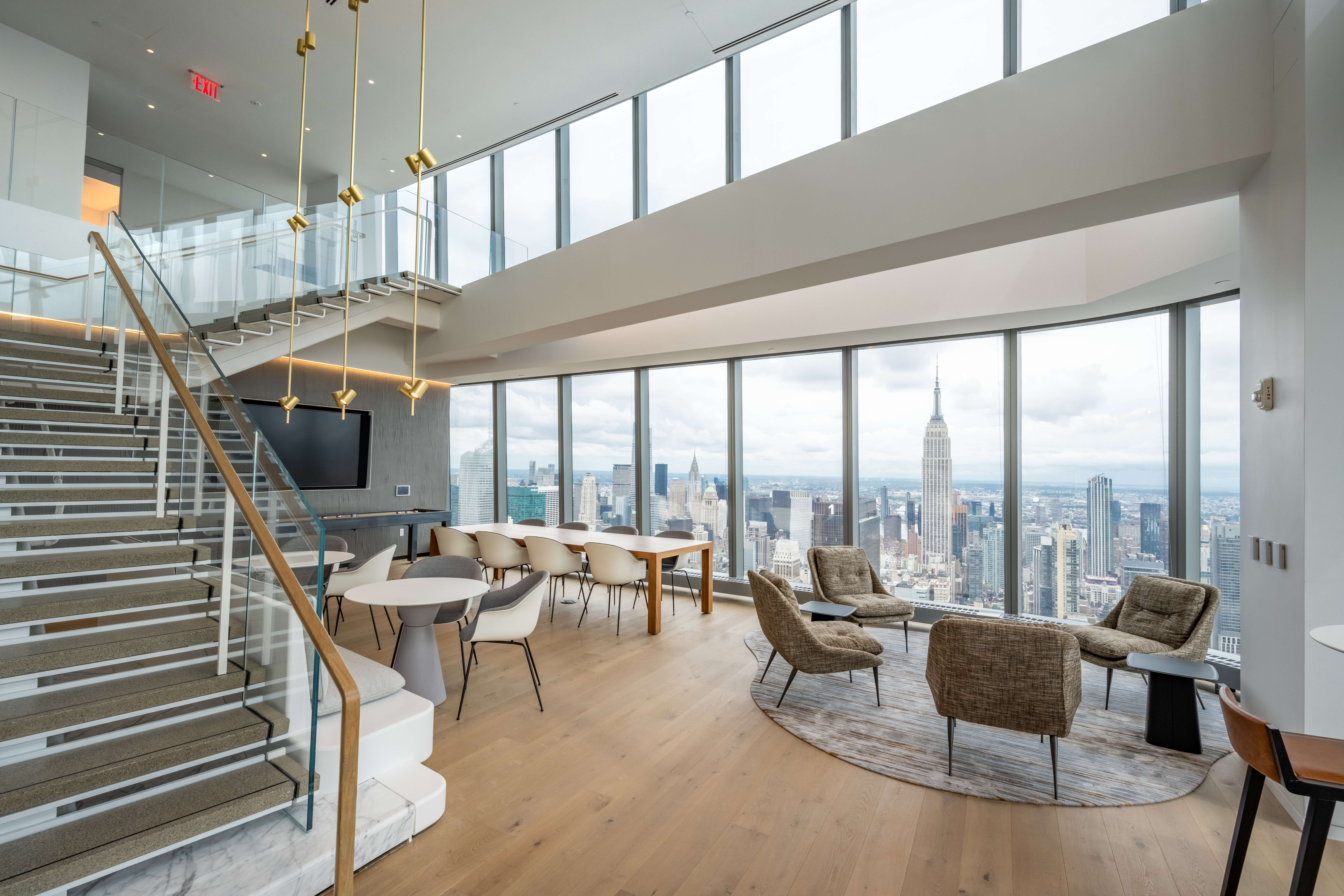 One Manhattan West tenant space with stairwell, tables and chairs