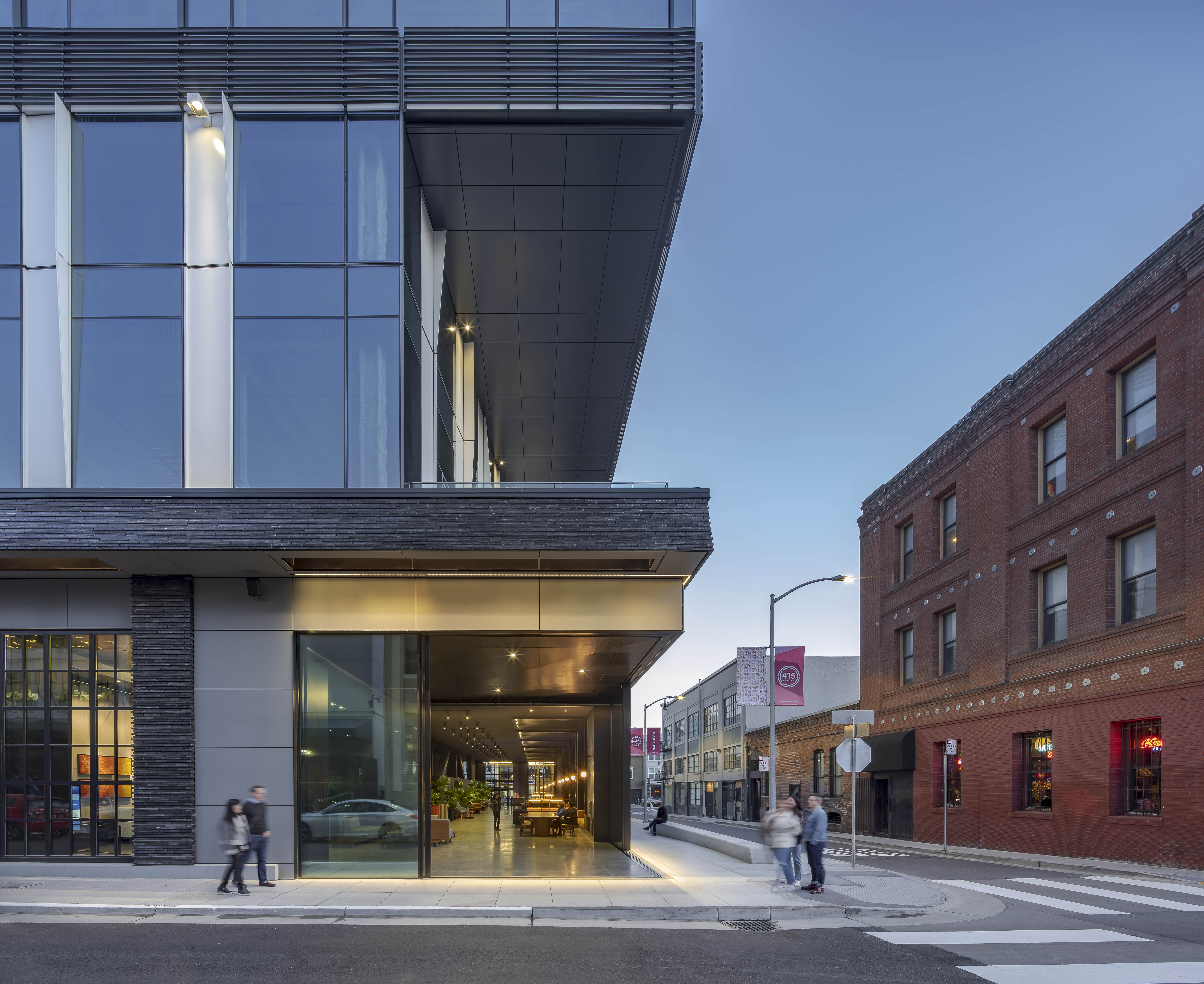 415 Natoma exterior view of building from across the street, of the entrance and large windows on each floor.