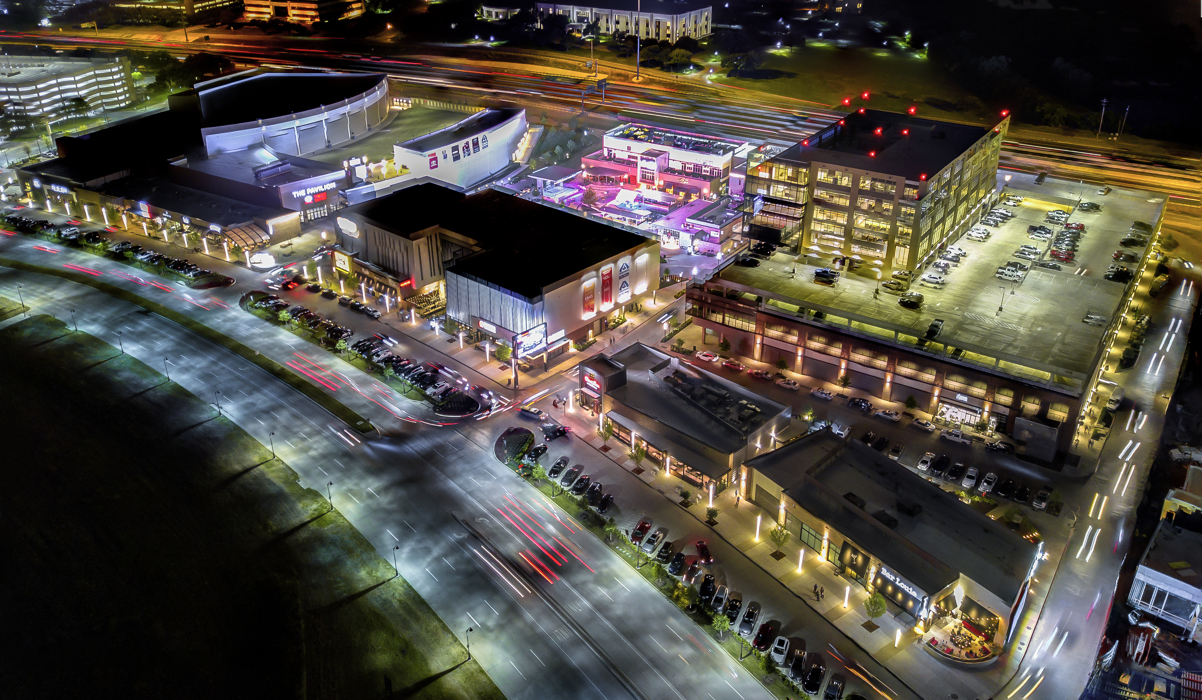 Toyota Music Factory aerial view of property block at night.
