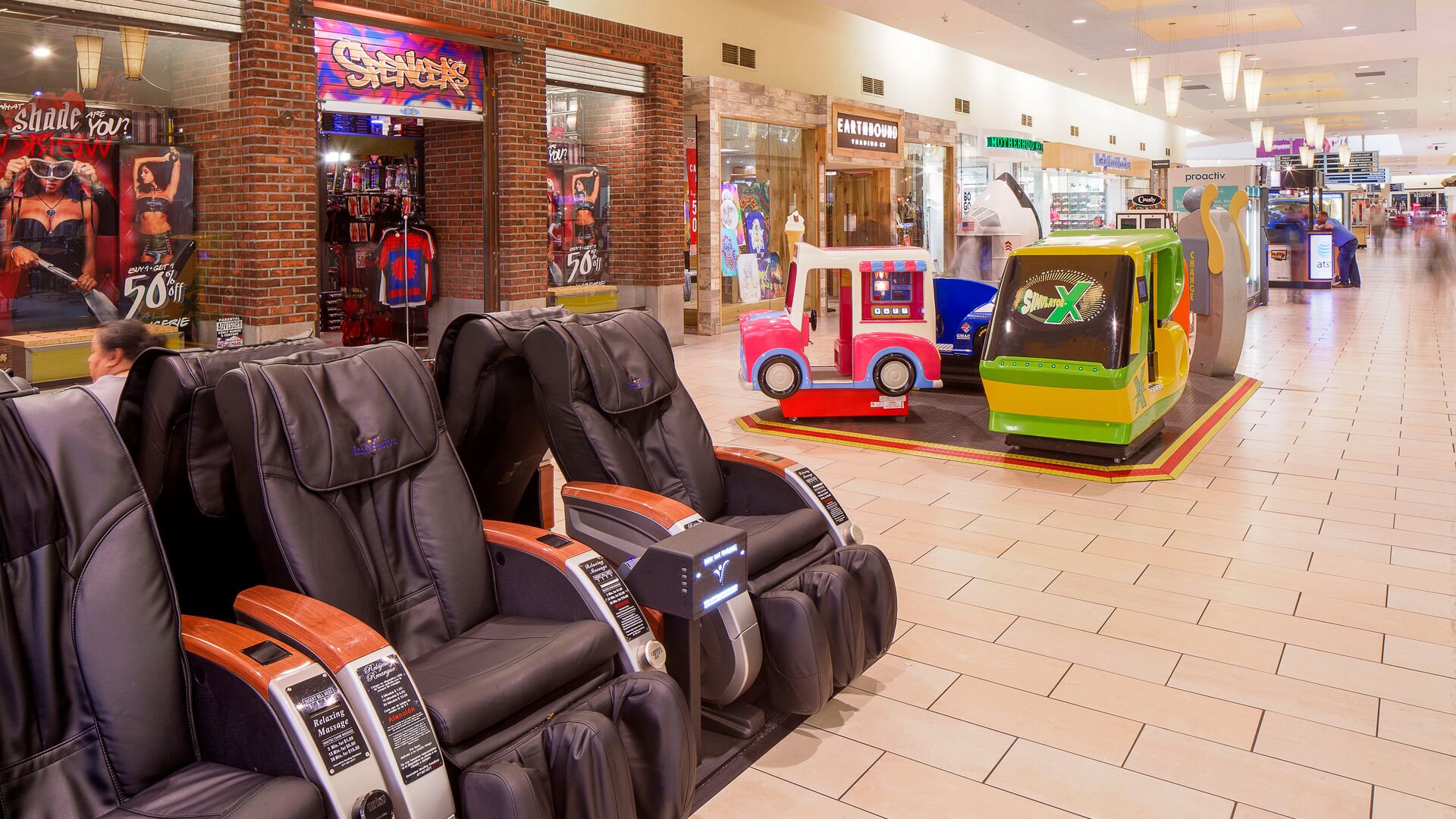 Interior hallway with massage chairs and children's play area