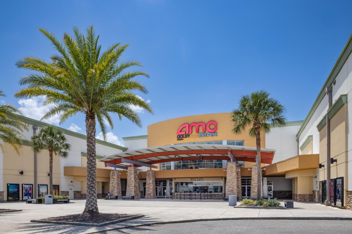 Outdoor view of AMC theater with palm trees