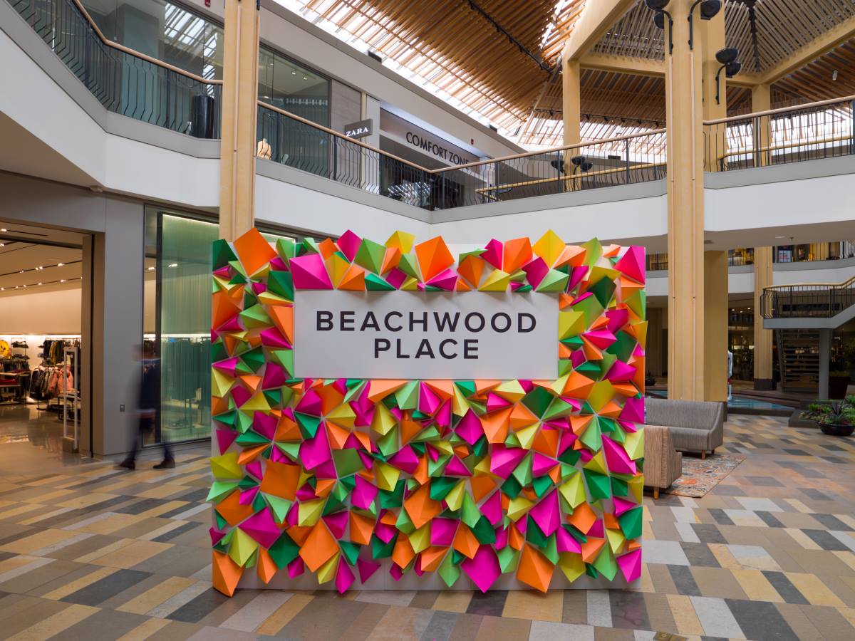 Beachwood Place sign with bright neon colored diamond shaped decorations