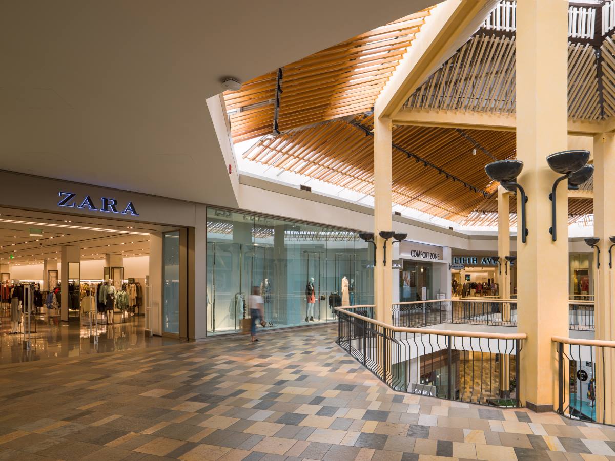 Interior of shopping center showing Zara storefront