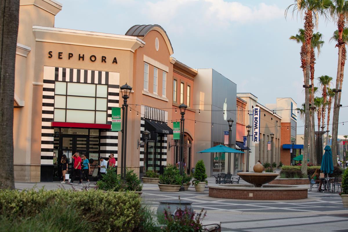 Outdoor photo of the shopping center showing several storefronts including Sephora