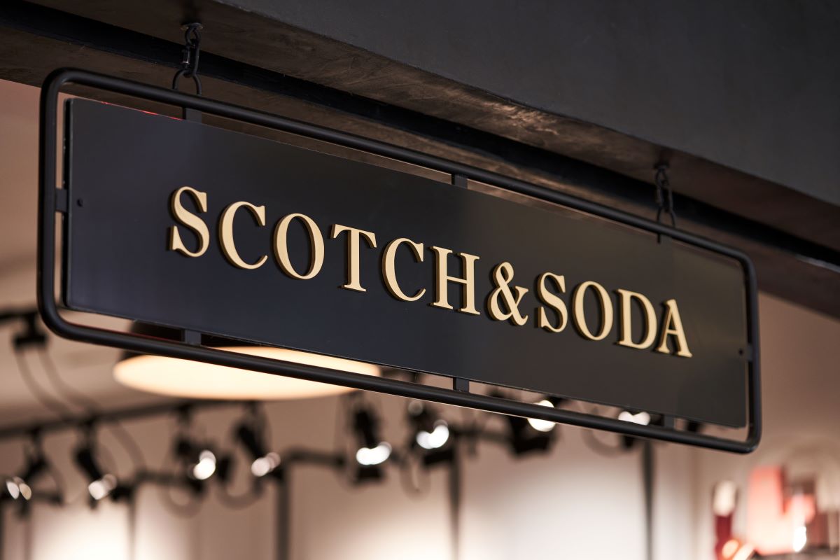 Scotch & Soda hanging black metal sign with gold lettering