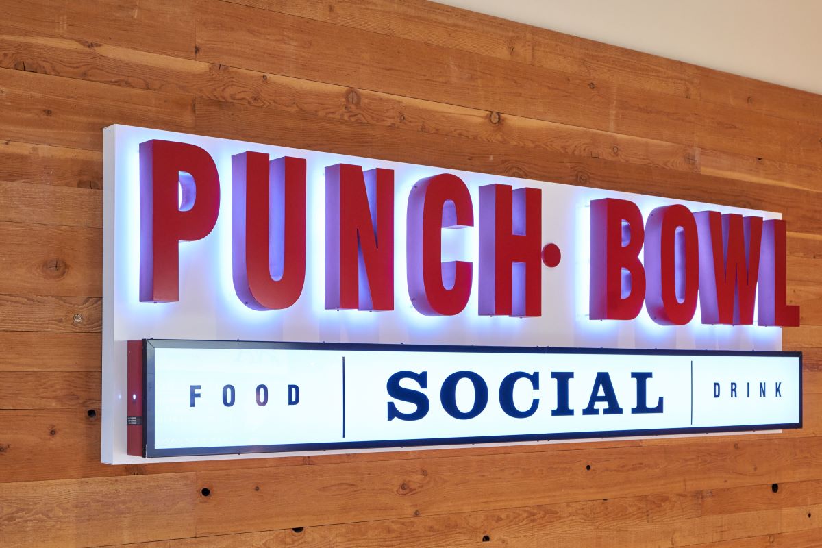Punch Bowl Social sign on wood background