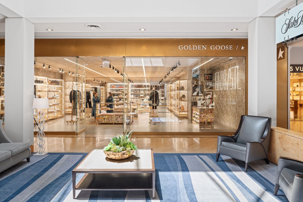 Golden Goose storefront and soft seating space in the mall