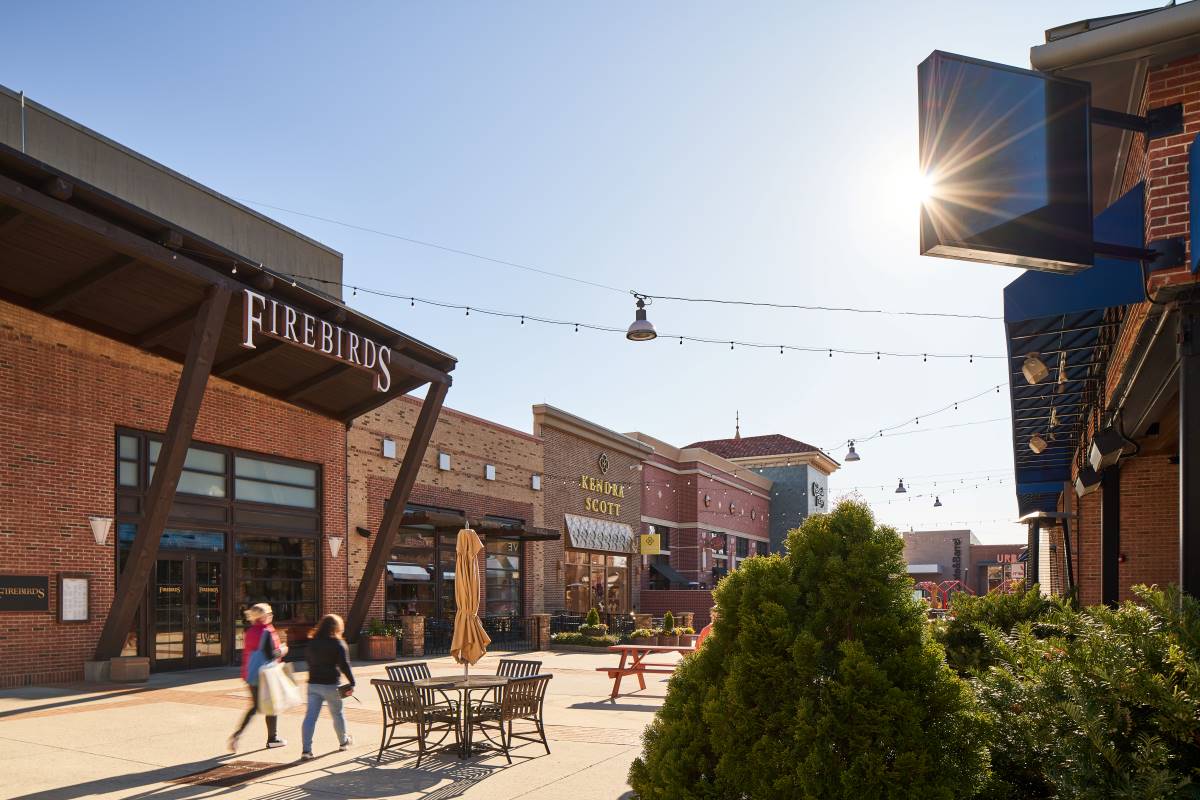 Outdoor view of Streets at Southpoint featuring several retailers including Firebirds and Kendra Scott