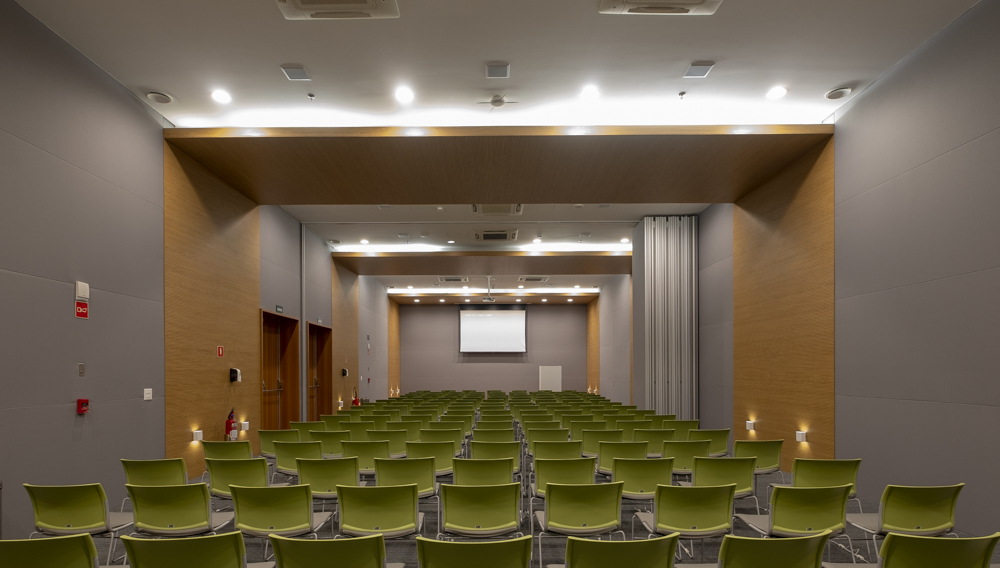 Ventura Towers conference hall with several chairs and video display