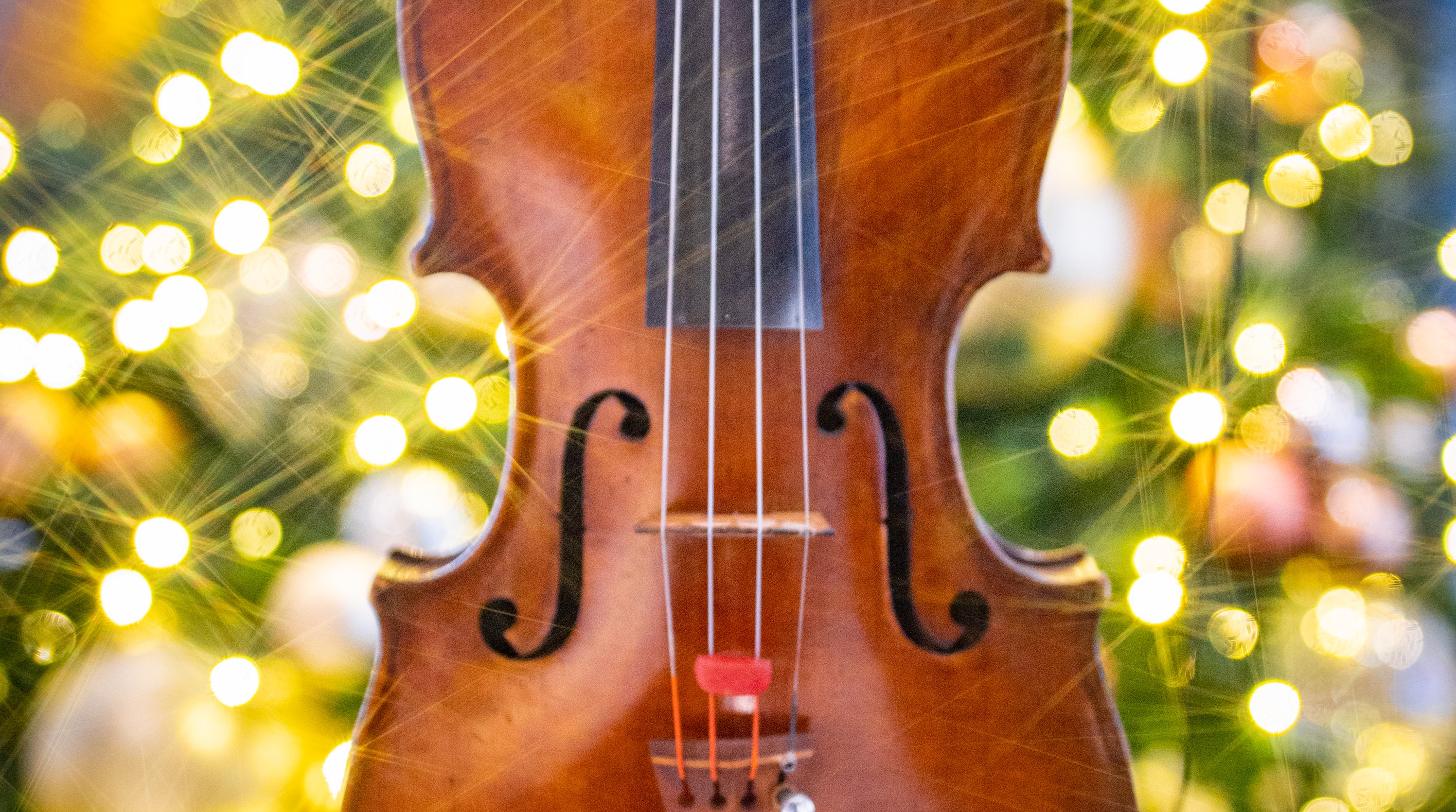 Violin with lights behind it