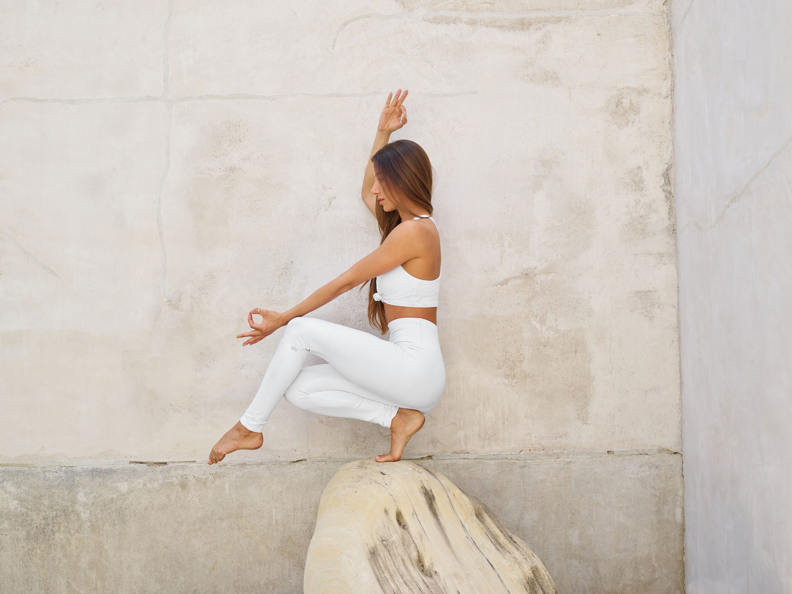 girl balancing on a rock